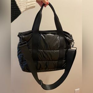 Black puffy purse/laptop bag.